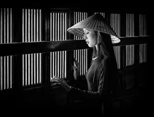 B And W Prints: Local woman wearing tradtional Ao Dai dress and conical hat at Minh Mang King Tomb