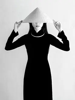 Local Woman Prints: Local woman wearing tradtional Ao Dai dress and conical hat at Minh Mang King Tomb