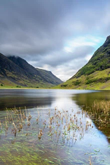 Images Dated 11th August 2022: Loch Achtriochtan in valley against cloudy sky, Glencoe, Scottish Highlands, Scotland, UK