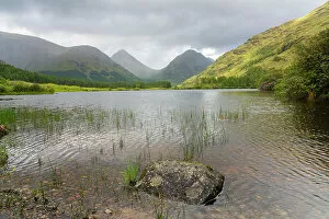 Lochan Urr against mountains, Glencoe, Scottish Highlands, Scotland, UK