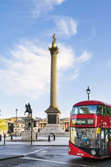 London bus passing the National Gallery and St Martin in the Fields church in Trafalgar London bus passing the National Gallery and St Martin in the Fields church in Trafalgar
