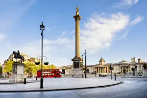 London bus passing the National Gallery and St Martin in the Fields church in Trafalgar