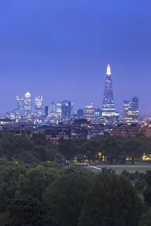 London skyline with the Shard above Hyde Park, London, England, UK