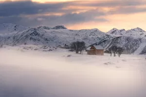 Safari Lodge Gallery: Lone cabin during a windy winter sunset in Lofoten islands, Norway