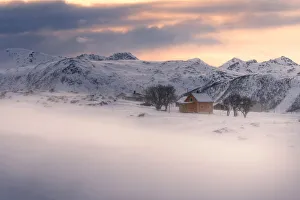 Rugged Peak Prints: Lone cabin during a windy winter sunset in Lofoten islands, Norway