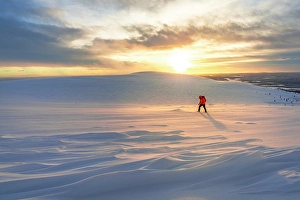 One Person Prints: Lone hiker snowshoeing in deep snow at dawn