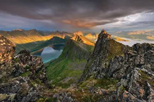 Rainy Prints: A lone person standing on the top of Husfjellet, Senja Island, Norway