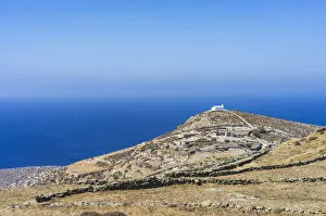 Images Dated 3rd November 2021: Lonely tree on a hill against blue sea, Folegandros, Cyclades, Greece