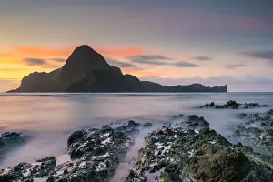 Long exposure of Cadlao Island on Bacuit Bay at sunset seen from Caalan Beach, El Nido