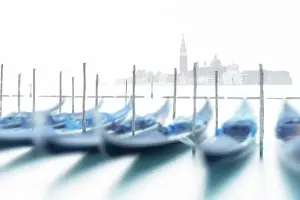 Canal Prints: Long exposure of romantic gondolas moored side by side on St Mark's waterfront