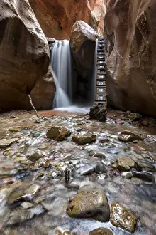 Gulch Prints: Long exposure at waterfall and ladder in Kanarra Creek Canyon. Kanarraville, Iron County