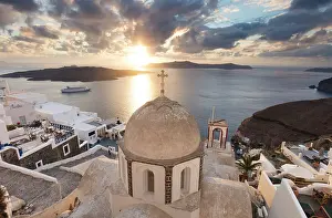 Looking out to the caldera over an old domed church, Fira, Santorini, Cyclades Islands, Greece, Europe