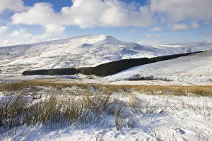 Looking towards Fan Fawr mountain from the snow covered slopes of Pen y Fan, Brecon Beacons National Park, Powys, Wales