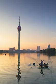Images Dated 10th June 2019: Lotus Tower on Beira Lake at sunrise, Colombo, Sri Lanka