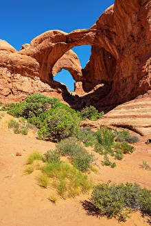 Grand County Prints: Low angle view of popular Double Arch on sunny day, Arches National Park, Utah, USA