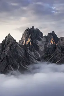 High Prints: Low fog partially covering the Cadini di Misurina at sunrise in the Dolomites, Italy
