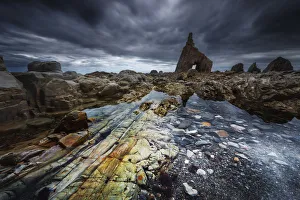 Low tide at Playa de Campiecho during a storm afternoon, Asturias, Spain