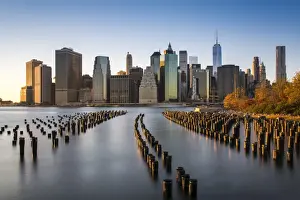 Lower Manhattan skyline at sunset from Brooklyn Bridge Park, Brooklyn, New York, USA