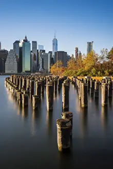 Lower Manhattan skyline at sunset from Brooklyn Bridge Park, Brooklyn, New York, USA
