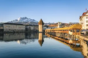 Lucerne, Switzerland. Kapellbrocke (Chapel Bridge) on Reuss river and mount Pilatus