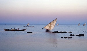Wooden Boats Prints: Luo fishing boats leave the eastern lakeshore of Lake