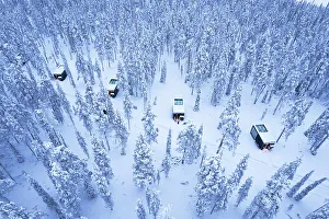 Building Exterior Prints: luxury glass igloos in the forest covered with snow