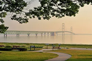 Benches Prints: Mackinac Bridge across the Straits of Mackinac at dawn, Mackinaw city, Michigan, USA