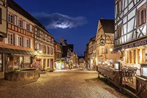 Grand Est Prints: Main street with traditional half-timbered houses