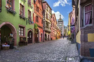 Grand Est Prints: Main street with traditional half-timbered houses and Dolder watchtower