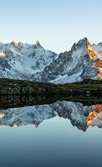 Majestic Prints: Majestic snowy Mont Blanc Massif and Dent du Geant mirrored in Lacs des Cheserys at sunset