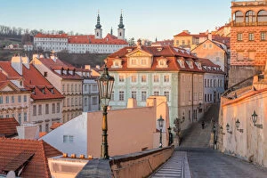 Palaces Gallery: Mala Strana palaces with Strahov monastery in the background at sunrise, Prague