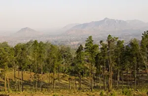 Malawi, Zomba. View over the town of Zomba from the lower slopes of Zomba Plateau where once there was dense