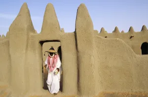 Adobe Gallery: MALI, Djenne A pilgrim emerges from prayers at a traditional