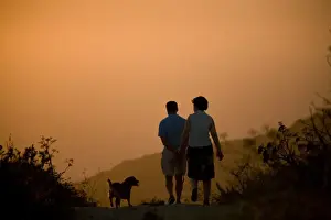 Walkers Prints: Malta, Dingli, Europe; A couple walking their dog on Dingli Cliffs during sunset