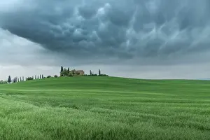 Wheat Prints: Mammatus clouds formations appearing over a countryhouse in the rolling hills of Val d'Orcia
