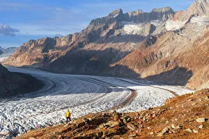 Standing Prints: A man admiring the Aletsch glacier from above