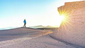 Catamarca Prints: Man admiring pumice fields at sunrise