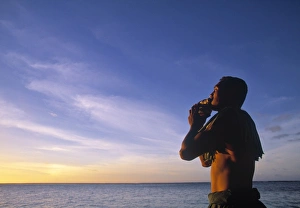 Single Person Prints: Man blowing into a seashell