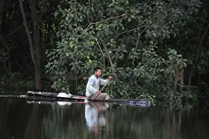 Images Dated 27th June 2012: Man in a dugout canoe on the Amazon River, near Puerto Narino, Colombia