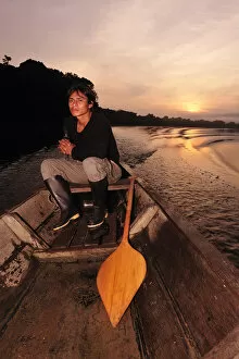Images Dated 27th June 2012: Man in dugout canoe on the Lago de Tarapoto, Amazon River, near Puerto Narino, Colombia