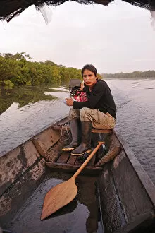 Paddle Gallery: Man in dugout canoe on the Lago de Tarapoto, Amazon River, near Puerto Narino, Colombia