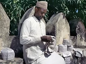 Islamic Dress Gallery: A man embroiders Swahili hats