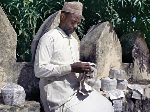 Islamic Dress Gallery: A man embroiders Swahili hats