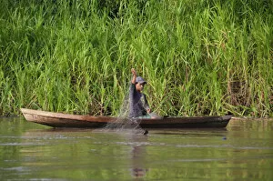Amazon Gallery: Man fishing on the Amazon River, near Puerto Narino, Colombia