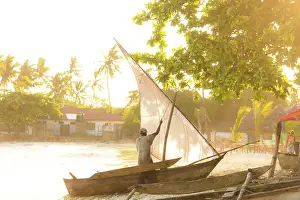 Dhow Prints: Man hoisting the sail of his dhow, Nungwi, Zanzibar, Tanzania
