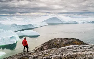Danish Territory Prints: Man above Kangia Glacier inear the village of Ilulissat, Greenland