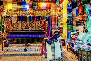 Factory Prints: Man at the loom, colorful fabrics. Fez, Morocco