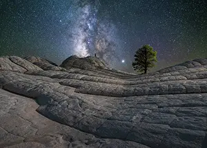 Southwest Prints: Man under Milky Way at White Pocket in Vermilion Cliffs National Monument, Arizona, USa