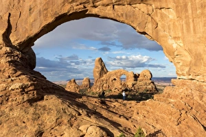 Man overlooking Turret Arch from North Window. Arches National Park, Moab, Grand County Man overlooking Turret Arch from North Window. Arches National Park, Moab, Grand County