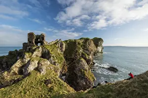 Headland Prints: Man photographing Kinbane Caste and headland on the Causeway Coast